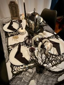 table setting display for Halloween with Goodwill items