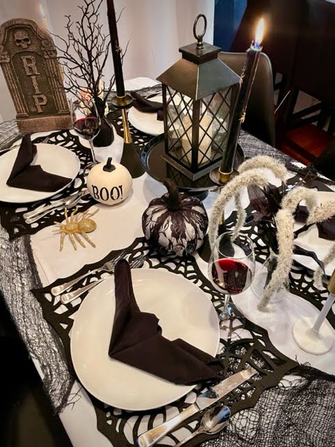 table setting for halloween party with items from Goodwill